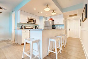 Kitchen and Condo Entrance View!