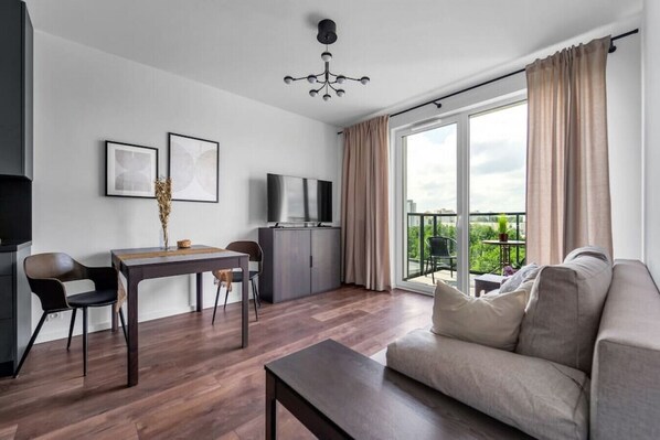 Living room with Full Sofa Bed and Smart TV | Book Now with RENTUJEMY.COM