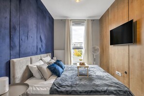 Main Bedroom with King-Sized Bed and TV | Book Now with RENTUJEMY.COM