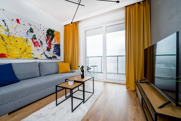 Living Room with Sofa Bed, Smart TV and Balcony | Book Now with RENTUJEMY.COM