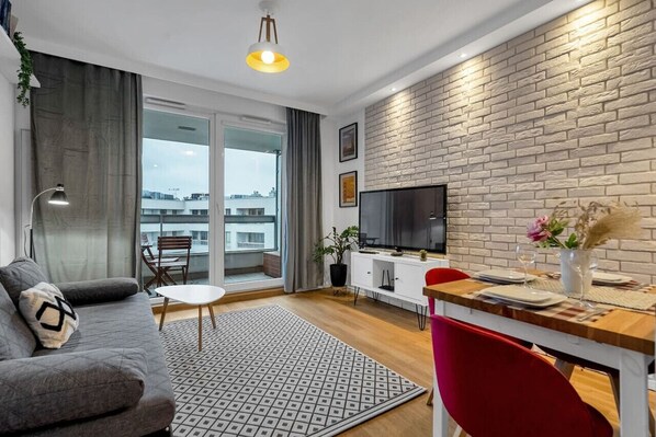 Main Living Area with a Smart TV- Book Now with RENTUJEMY.COM