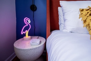 Convenience and charm of our side table, featuring a vibrant flamingo neon light complete with a USB port.