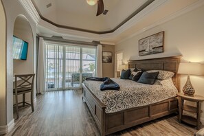 Elegant bedroom - - Sophisticated bedroom with a plush bed, warm tones and vaulted ceilings
- Wake up to natural light streaming through sliding doors that lead to a outdoor space
- Perfect for relaxing evenings, cozy mornings, and a serene retreat from the world