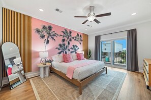 A deep nights sleep under the palm trees in this high end primary bedroom. 