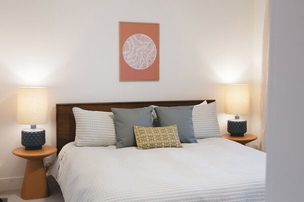 Master king bed with a clean aesthetic.