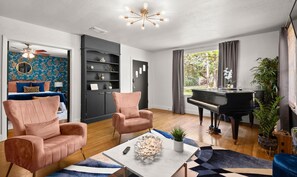 Capture the inviting essence of this home with a view from the living room to the front door, showcasing seamless design and warm hospitality right from the entrance.