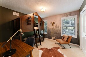 The Mountain Room: bunk beds with 2 twin sized beds with work desk and a small pull out TV. A big hit with the kiddos! 