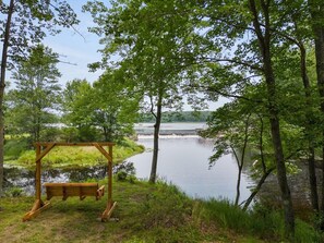Larsen Dam Experience: Wooden swing, waterfall views, peaceful sounds, complete privacy.
