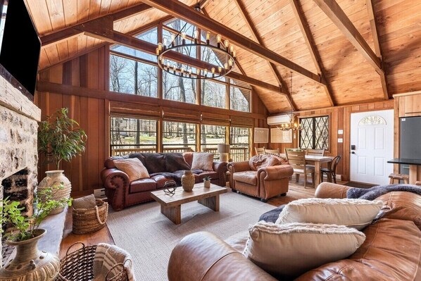 Our stunning extra-large A-frame windows let in tons of natural sunlight, filling the space with warmth and bright vibes all day long! Learn more about our guest experience at truenorthpocono.com!