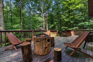 Cozy outdoor firepit powered by propane, complete with comfortable seating for relaxation.