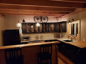 These kitchen cabinets were made by a local from the maple cut from the property