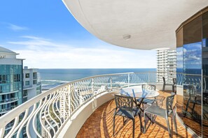Balcony features glittering ocean and city views