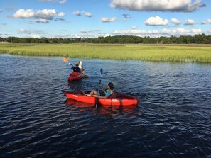 Kids kayaking just off the dock