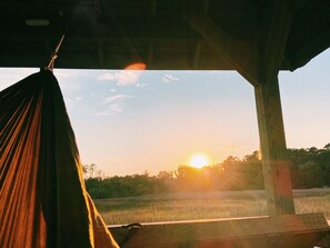 Sunset view from the dock; there are 4 sets of hammock hooks on the dock
