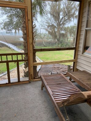 Screened in porch facing the marsh