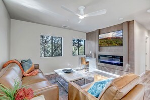 Living Room with Leather Furnishings, Electric Fireplace and Smart TV