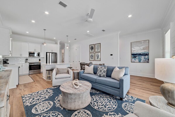Step into the living room adorned with elegant accents and decor, where tasteful details and stylish furnishings blend to create an inviting atmosphere, perfect for luxurious relaxation and entertaining.