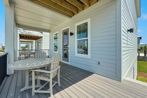 As the sun moves throughout the day, a comfortable balance of cool shade and radiant sunshine provides the perfect ambience for creating memorable outdoor experiences on the covered balcony.