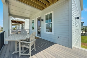As the sun moves throughout the day, a comfortable balance of cool shade and radiant sunshine provides the perfect ambience for creating memorable outdoor experiences on the covered balcony.