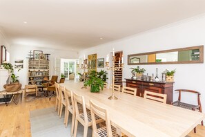 Dining area that can seat 10-12 people off the open plan kitchen.