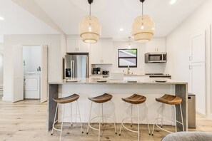 Start your day right! Our kitchen with a breakfast bar offers the perfect spot to enjoy your morning coffee and plan your adventures.
