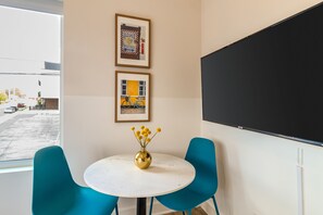 Dining area and large flat-screen TV.