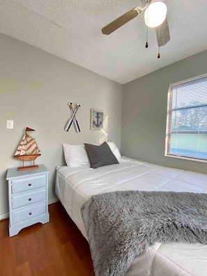 Upstairs bedroom with queen bed and nautical themed decor!