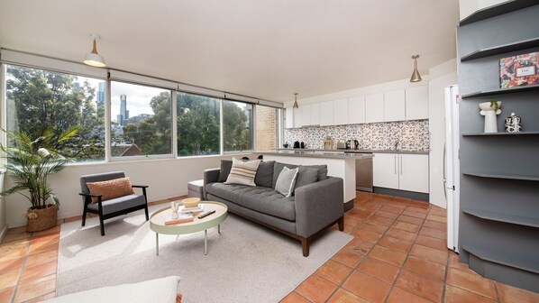 Seating area in the common area with the kitchen on its back 