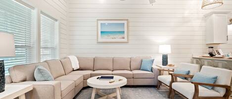 Bright living area perfect for relaxing, playing games, and making memories together!