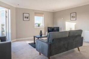 Sit and gaze out the French doors leading out to your very own turret balcony and take in the views