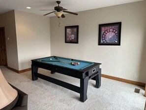 Game area with a pool table for a leisurely stay in our cozy second living room.