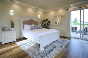 The master bedroom has third-story deck access, smart TV, and canyon views. 