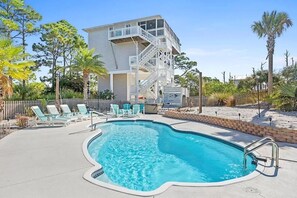 Large saltwater pool, lots of outdoor furniture and immaculate landscaping