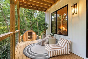 Recharge on your private wellness deck with a sauna and cozy lounge area—perfect for cooling off and unwinding in the fresh mountain air.