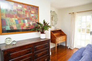 Dresser, desk and door to garden in lounge