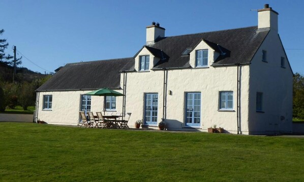 View of garden and picnic bench outside Brynceirios