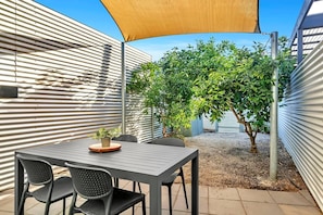 The yard has a shade cloth and a large leafy tree, so you can enjoy some relaxation with the comfort of shady protection. 
