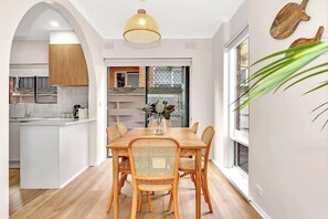 A six-seater dining table is the perfect spot to enjoy breakfast together while you plan your day.   
