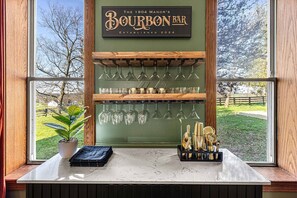 With an array of glassware and barware, The 1904 Manor's bourbon bar is sure to impress.