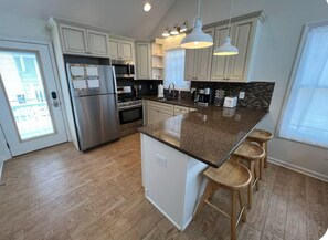 Eat-in kitchen with swivel seating for *4.