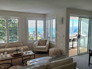 Lounge and internal patio areas with sea views middle floor