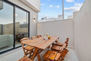 Dine under the open sky in this peaceful outdoor dining setting.