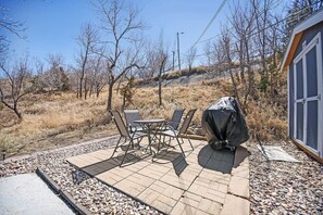 Outdoor dining area equipped with a convenient gas grill, ideal for al fresco meals and entertaining guests in the fresh air