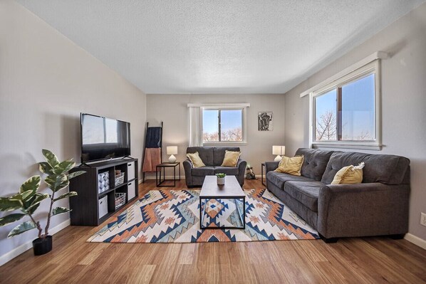 A cozy and inviting living room adorned with plush furnishings perfect for relaxation and gatherings with loved ones.