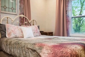 Snuggle into soft linens, plush pillows, and a Queen bed that invites lazy mornings and sweet dreams!