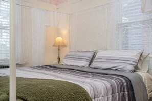 Relax and recharge in our cozy bedroom, complete with soft linens, comfy pillows, and storage space!
