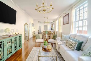 The living space features a Smart TV and pull out couch.
