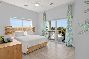 1 of 2 3rd level master bedrooms with ensuite bathroom and direct access to balcony that overlooks the pool and canal.