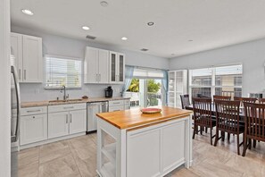 Kitchen/dining with an extendable island for extra counter space.