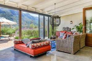 Covered outdoor entertaining area with  metal shutters. 